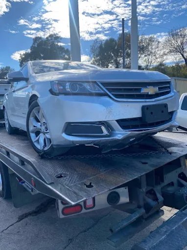 Chevy Impala on flatbed